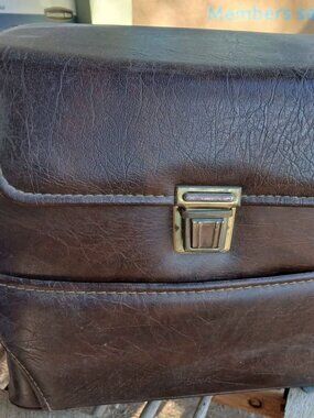 Vintage brown leather camera bag with Kodak booklet included
